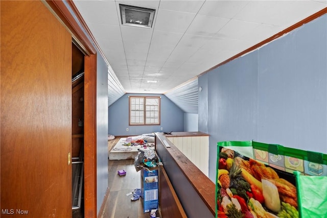 hall featuring vaulted ceiling