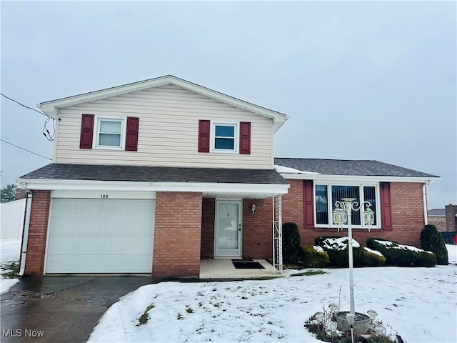 split level home with a garage