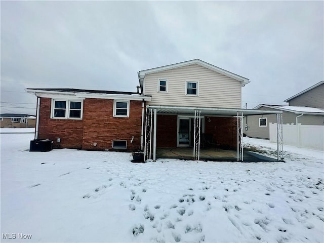 view of snow covered house