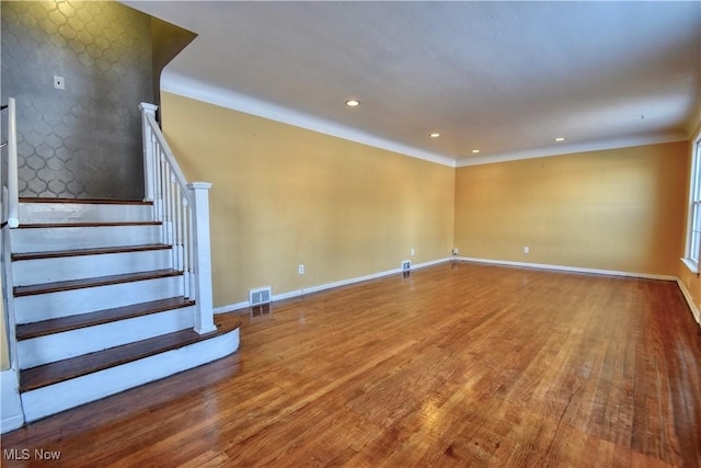 empty room with hardwood / wood-style flooring