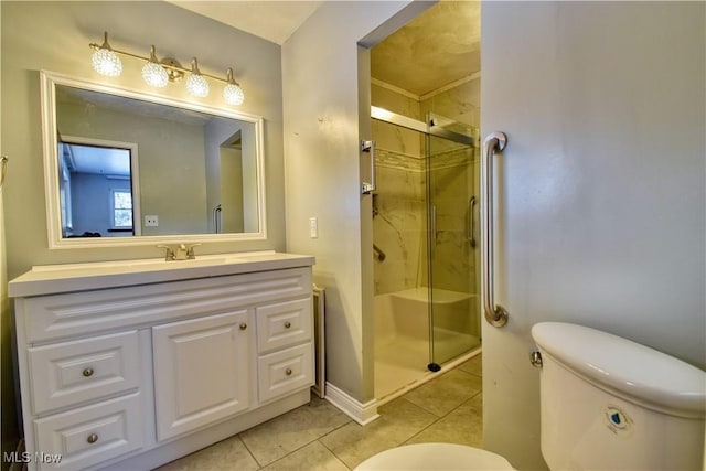 bathroom with toilet, tile patterned floors, a shower with door, and vanity