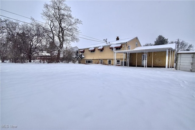 view of snow covered house