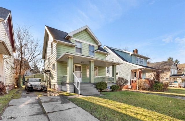 view of front of house featuring a front lawn and a porch