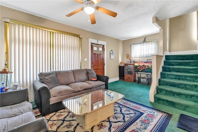 living room with ceiling fan and carpet floors