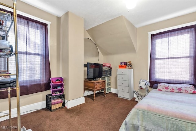 bedroom featuring dark carpet