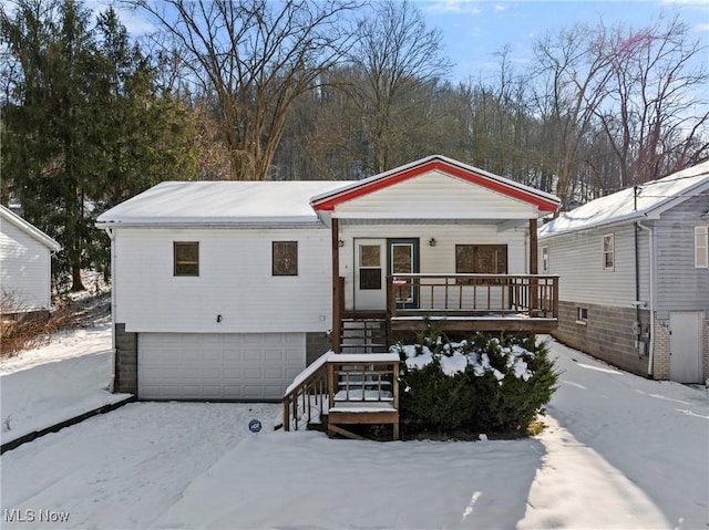 view of front of home featuring a garage and a porch