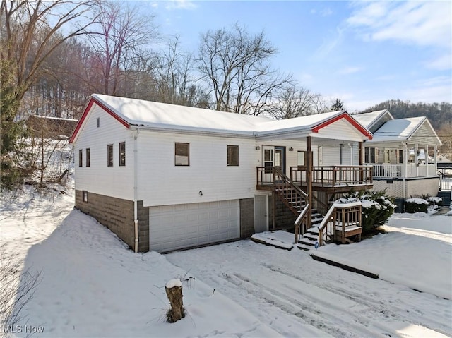 view of front of property with a garage and a porch