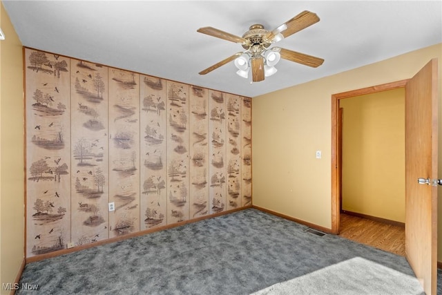 spare room with ceiling fan and carpet floors