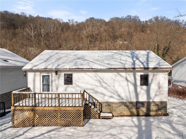 rear view of property with a deck