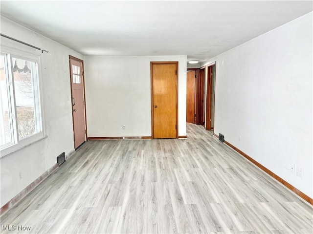 empty room featuring light hardwood / wood-style floors