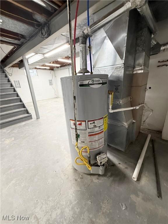 utility room featuring gas water heater