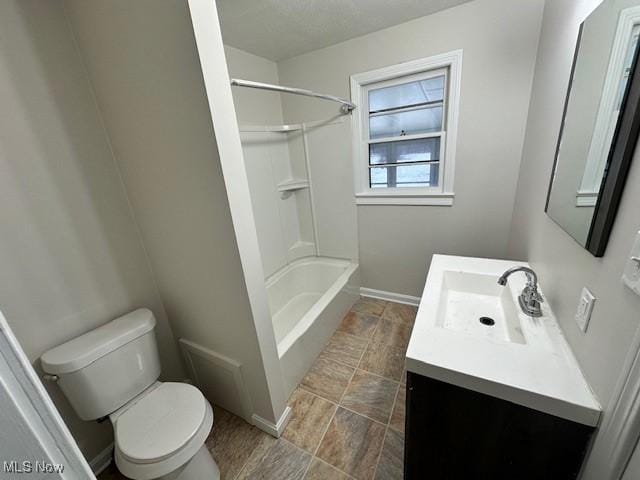 full bathroom featuring toilet, vanity, and bathing tub / shower combination