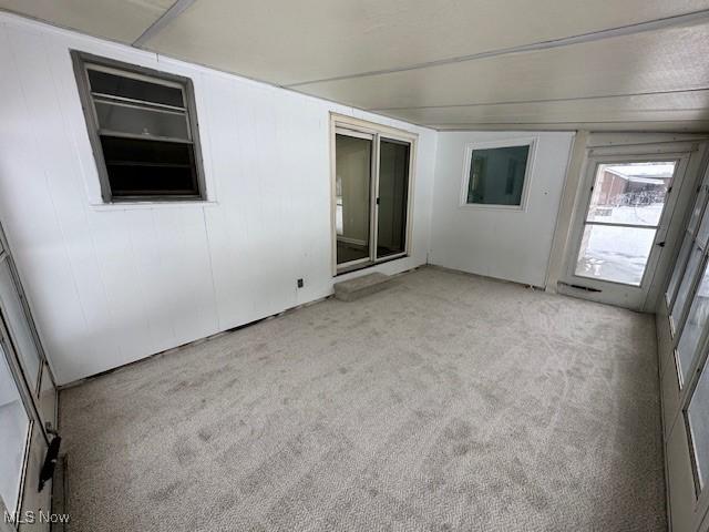 empty room with light colored carpet