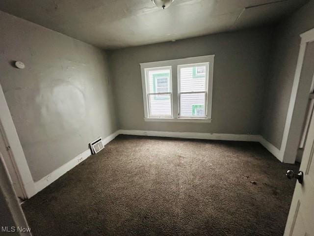 empty room featuring carpet floors