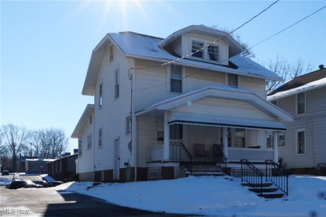 front facade featuring covered porch