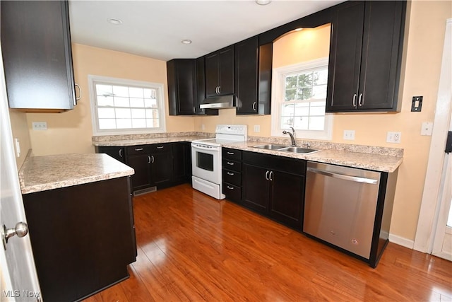 kitchen with light hardwood / wood-style floors, sink, white range with electric stovetop, and dishwasher