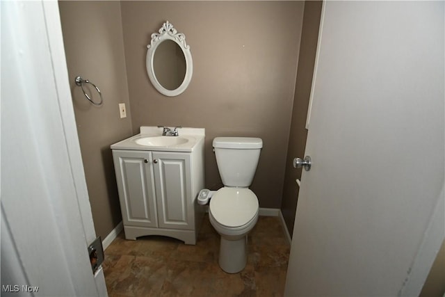 bathroom with toilet and vanity