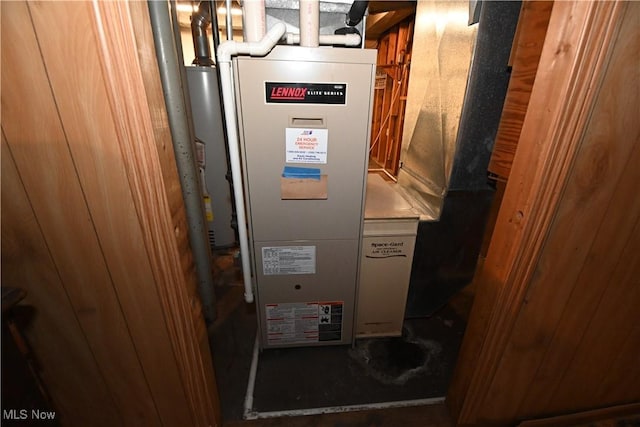 utility room featuring water heater