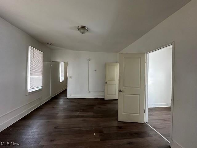 interior space with dark hardwood / wood-style flooring