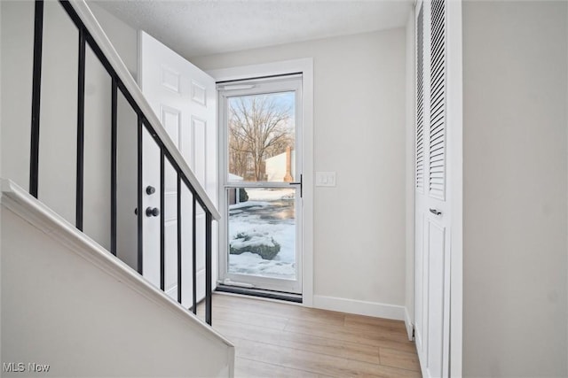 entrance foyer with light hardwood / wood-style floors