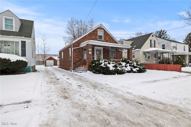 view of front of home with a garage and a porch