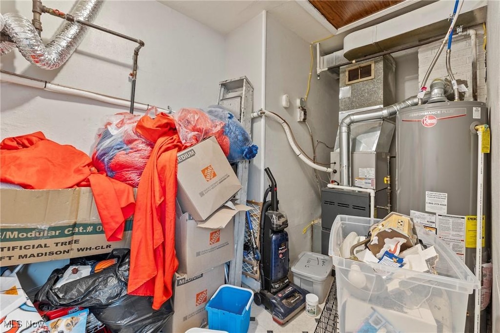 utility room with water heater