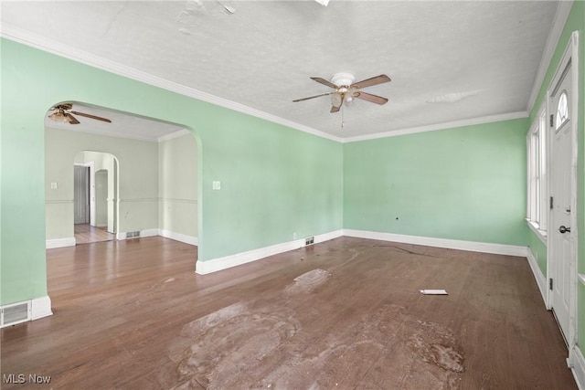 unfurnished room featuring hardwood / wood-style flooring, a textured ceiling, ornamental molding, and ceiling fan