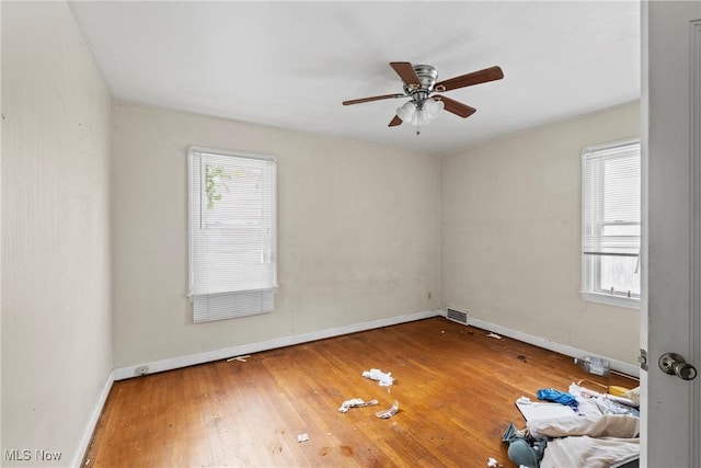 unfurnished room with ceiling fan and wood-type flooring