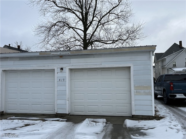 view of snow covered garage