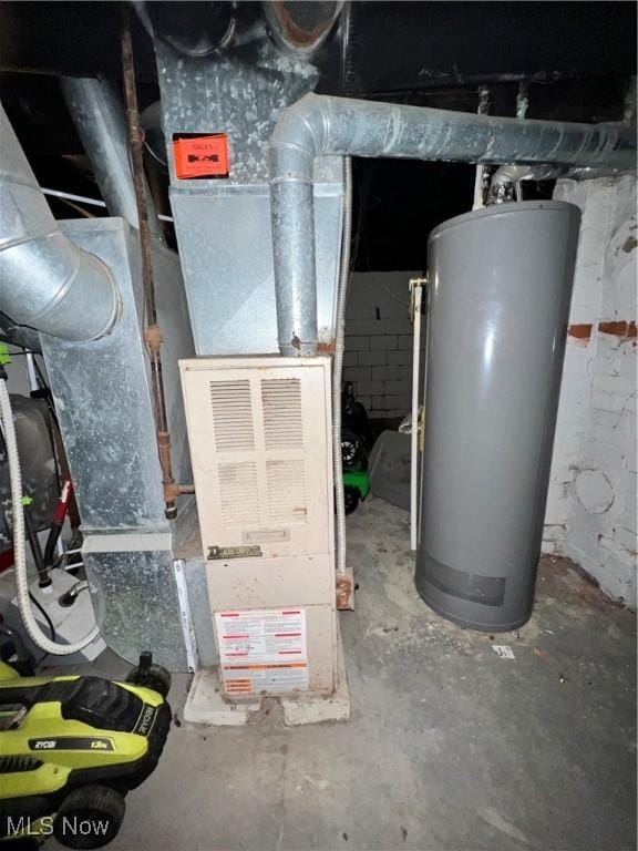 utility room featuring gas water heater