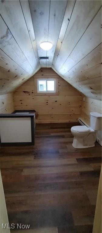 additional living space featuring lofted ceiling, dark wood-type flooring, wood ceiling, and wood walls