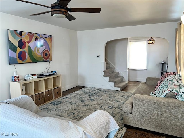 living room featuring ceiling fan and hardwood / wood-style floors