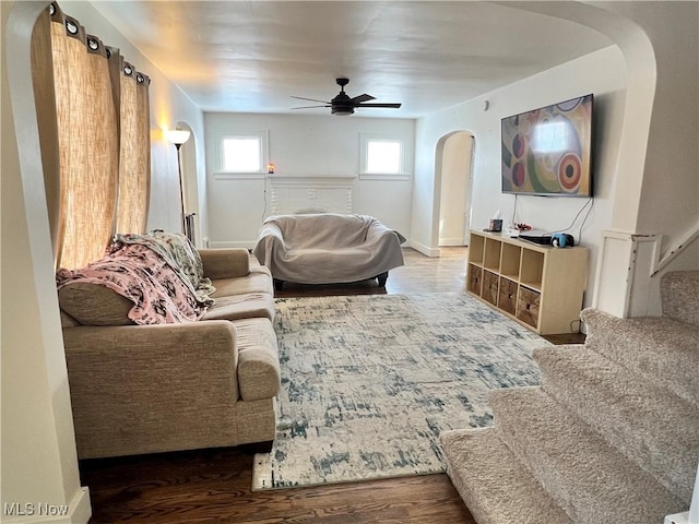 living room with ceiling fan and hardwood / wood-style floors