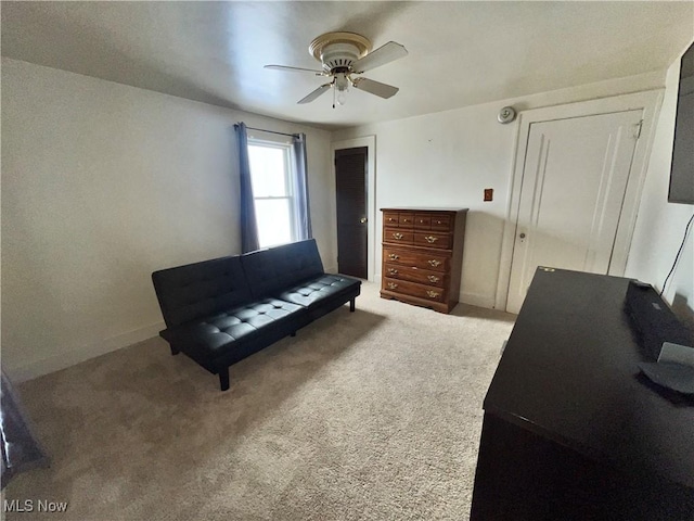 sitting room featuring ceiling fan and carpet flooring