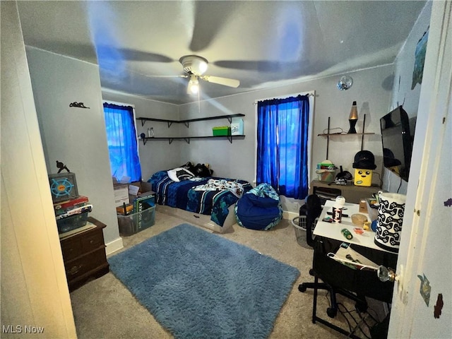 bedroom featuring ceiling fan and light colored carpet