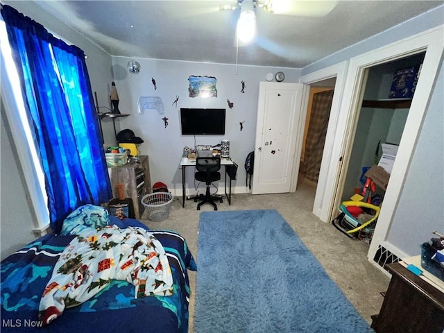 carpeted bedroom with ceiling fan