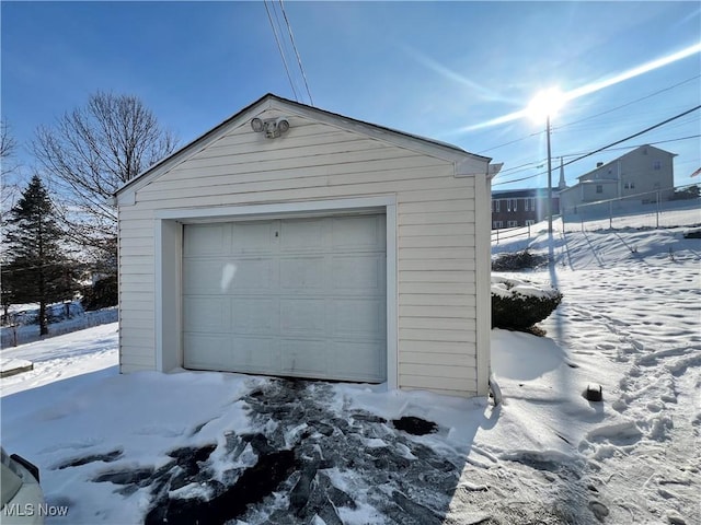 view of snow covered garage