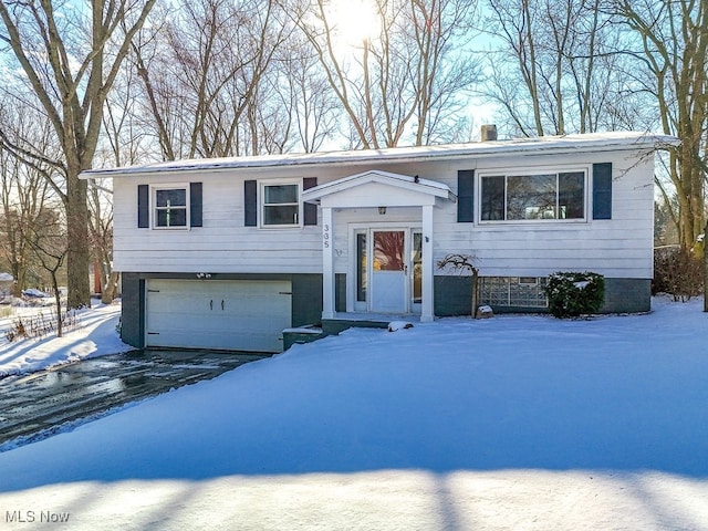 split foyer home featuring a garage