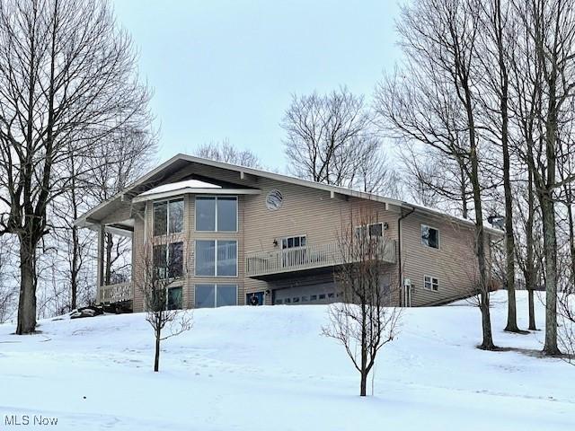 view of snow covered house