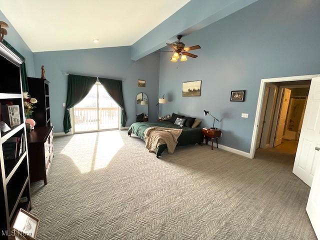 carpeted bedroom with ceiling fan, beam ceiling, and high vaulted ceiling