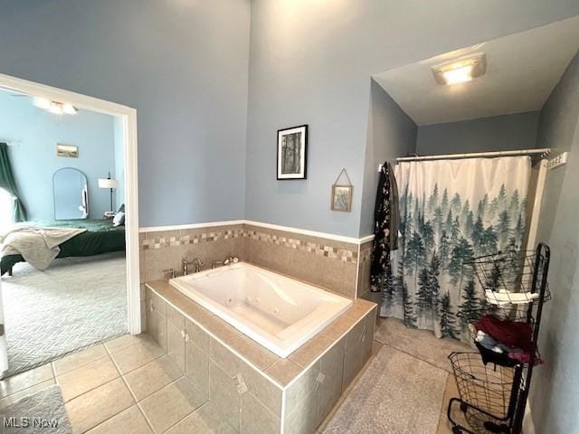 bathroom with tile patterned floors and independent shower and bath