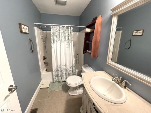 full bathroom featuring vanity, toilet, tile patterned flooring, and shower / bath combo with shower curtain