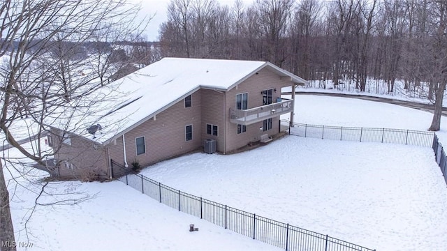 exterior space with a balcony and cooling unit