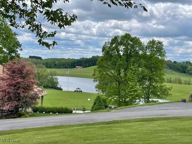 7716 N Ridge Pl, Lisbon, OH 44432 - surrounding community featuring a yard and a water view