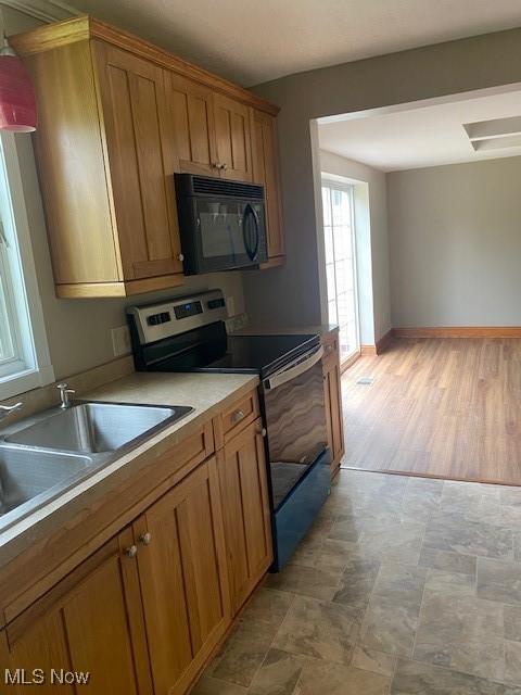 kitchen featuring sink and stainless steel electric range