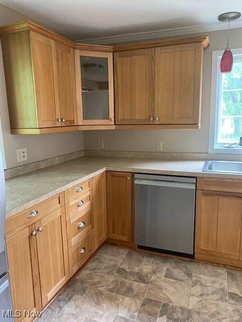 kitchen featuring ornamental molding, dishwasher, hanging light fixtures, and sink