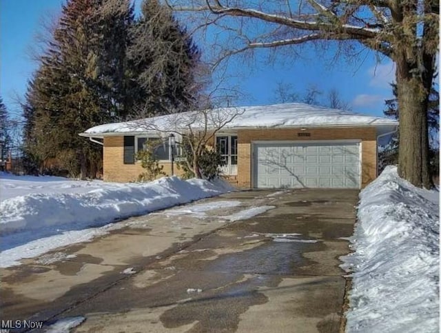 single story home with a garage