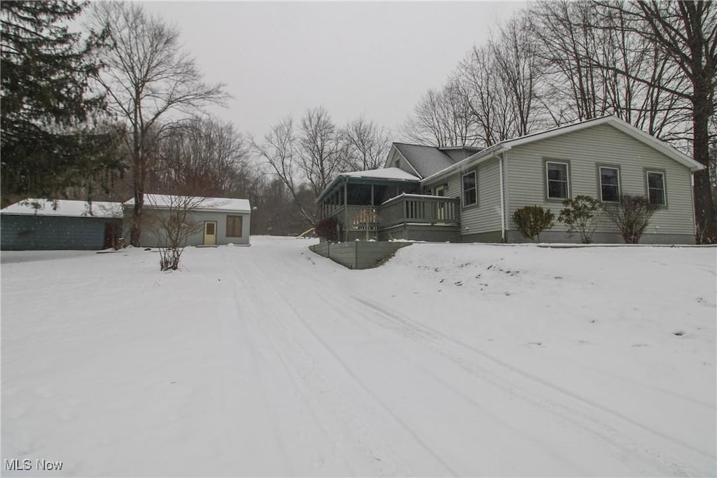 exterior space featuring a wooden deck