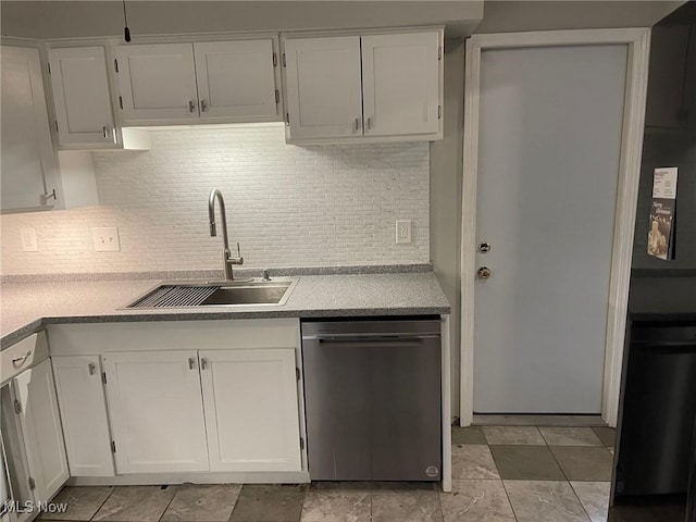 kitchen with backsplash, dishwasher, sink, and white cabinetry