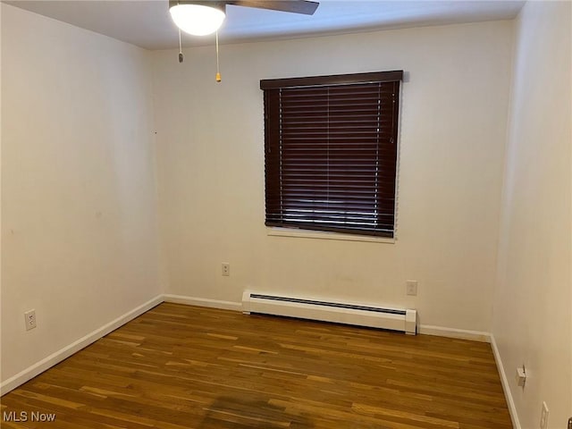 unfurnished room with baseboard heating, dark hardwood / wood-style flooring, and ceiling fan